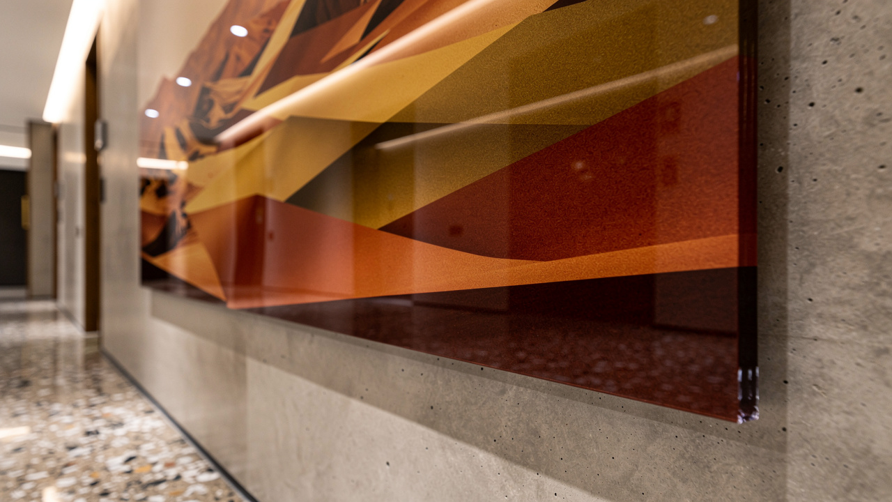 Close-up of UV printed acrylic panel in hotel corridor